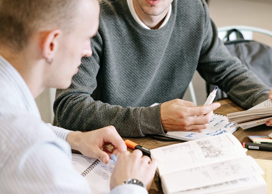 two men studying together